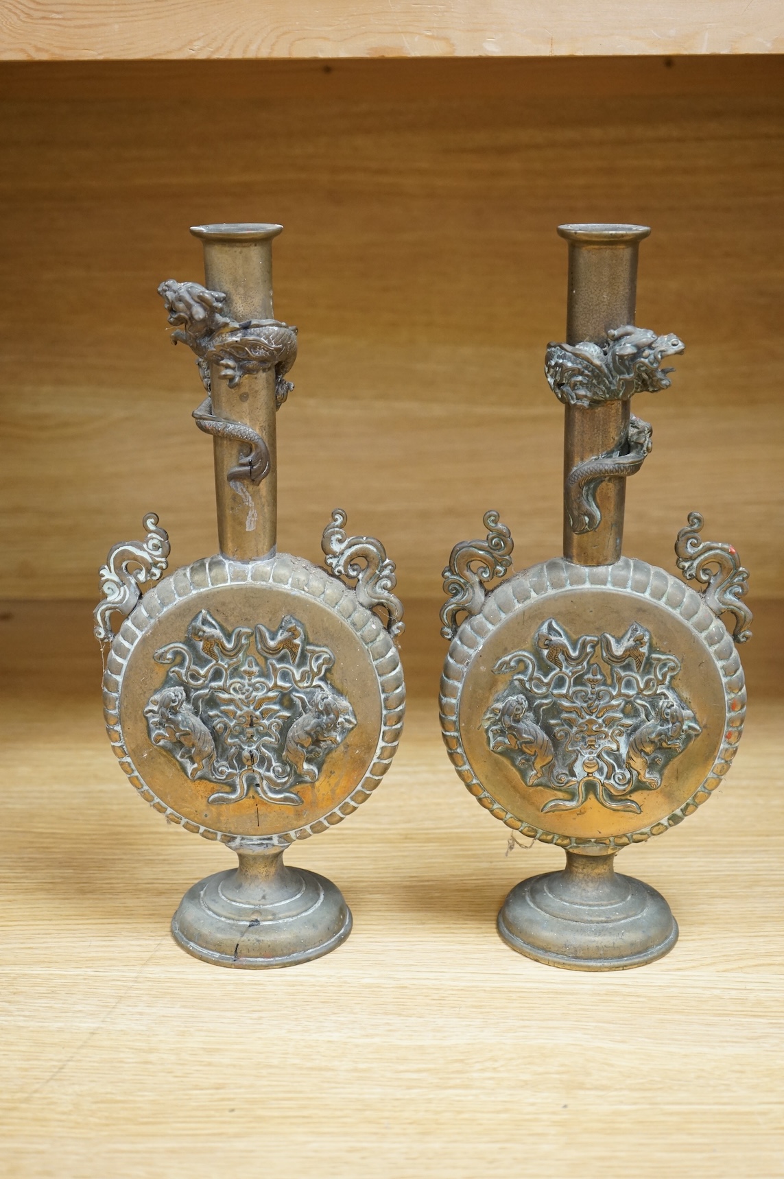 A pair of 19th century Japanese bronze moonflasks, with dragon motifs, 35cm high